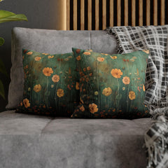 two pillows on a couch with a plant in the background